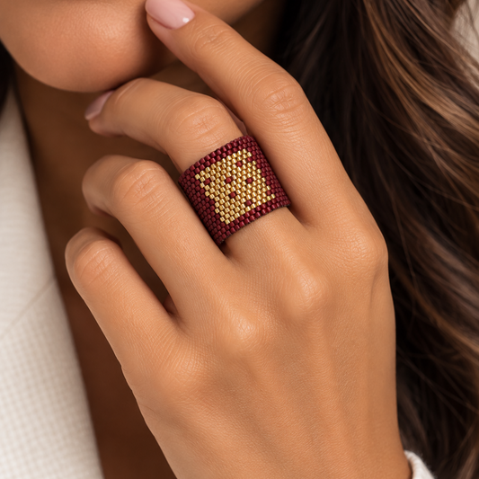 Monogram Burgundy and Gold Miyuki Ring worn on a model showing its wide geometric beadwork