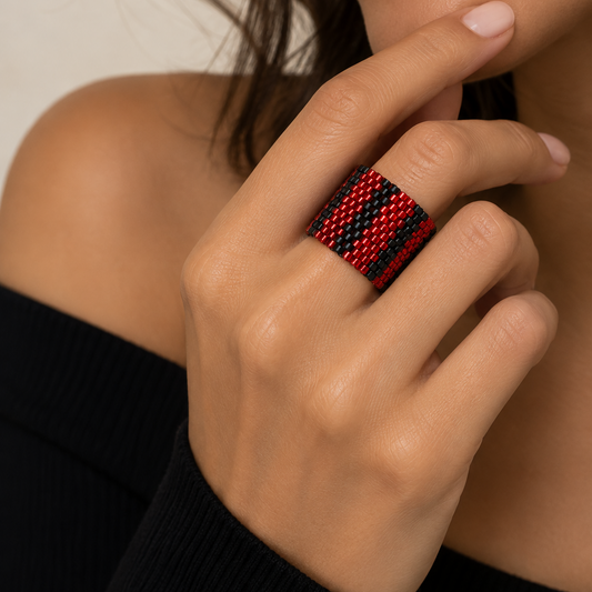 Pulse red and black Miyuki Delica statement ring worn on a model showing its 18 mm wide geometric design