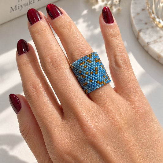 Tides blue and turquoise Miyuki Delica statement ring worn on hand showing its 21 mm wide design