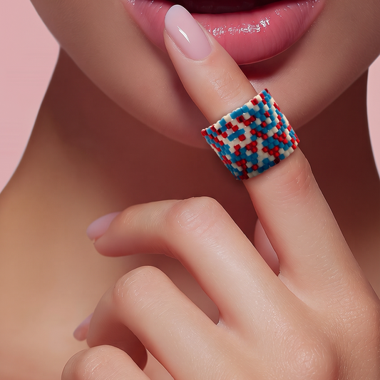 Model wearing a handmade miyuki delica statement ring in red, blue and white by Dailot.