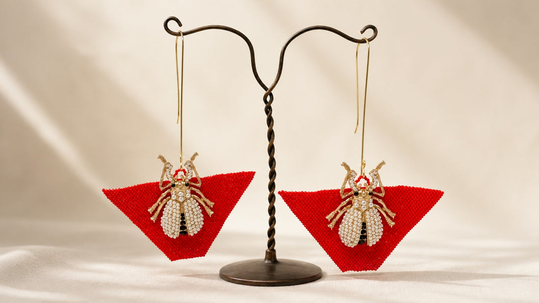 Handcrafted red statement earrings with jeweled beetle details by Dailot