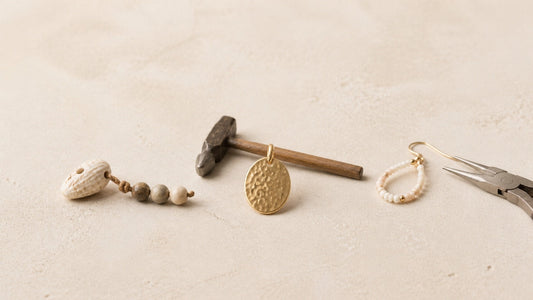 Minimal display showing the evolution of handmade jewelry from natural materials to modern craftsmanship