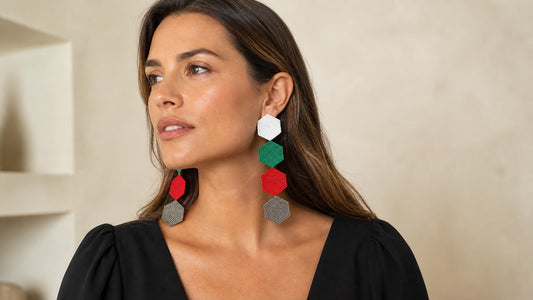 Woman styling bold geometric Dailot Miyuki earrings with an elegant black outfit