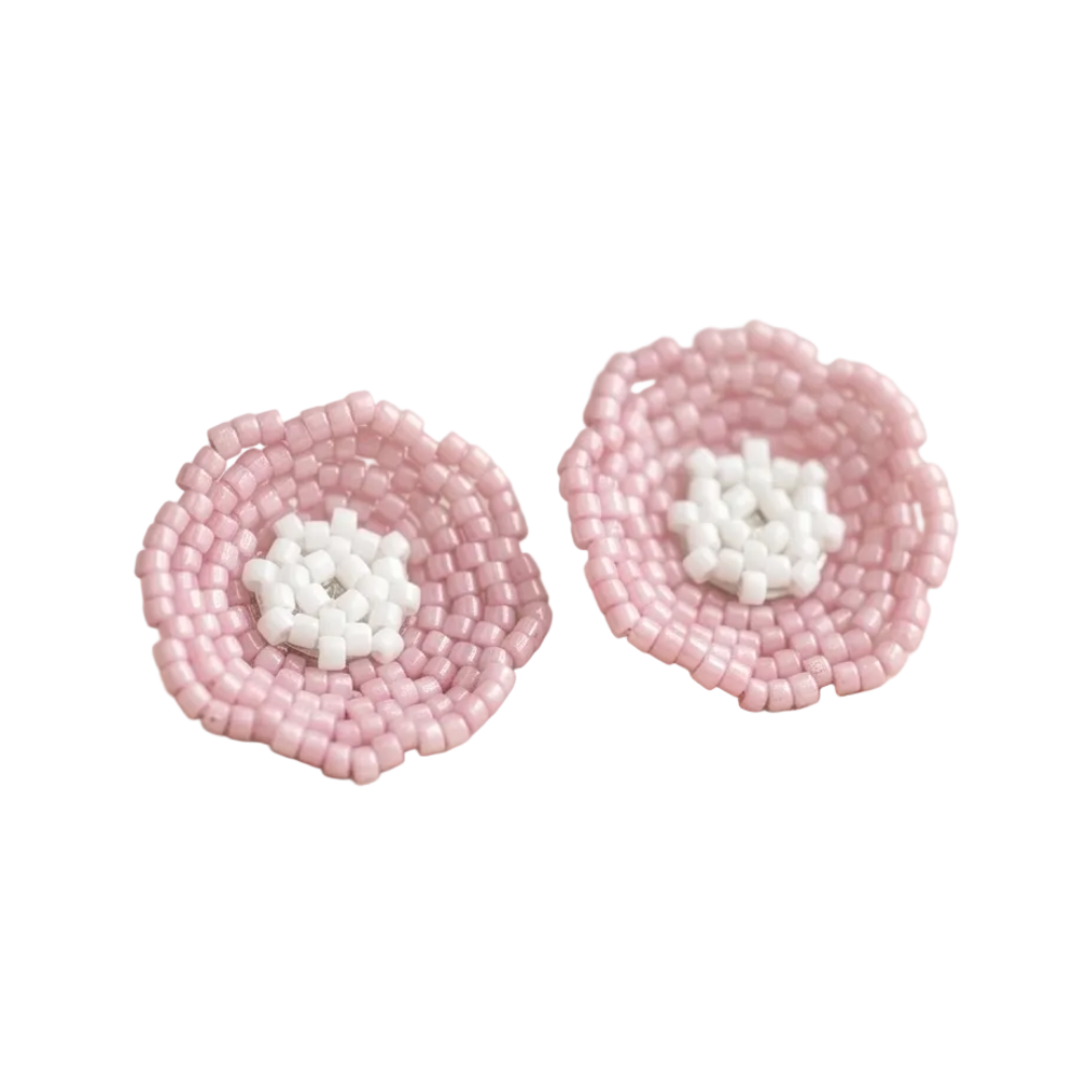 Pair of blush pink beaded flower stud earrings with white center.