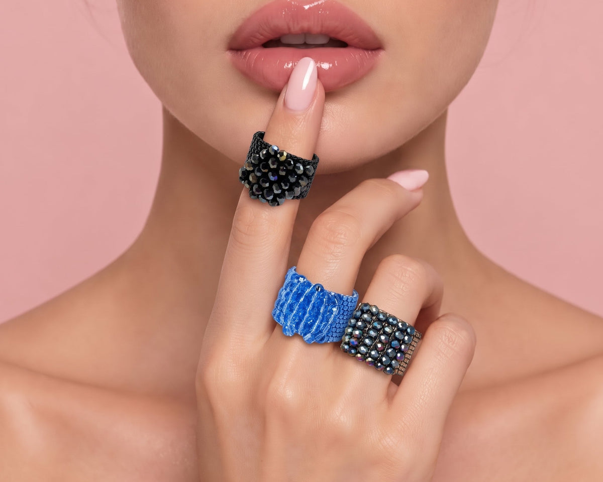 Crystal Blooms rings on model Hand with finger over lips 