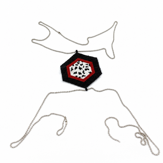 Black, red, and white hexagonal Miyuki Delica cross body chain with silver-tone ball chains arranged on a white background.
