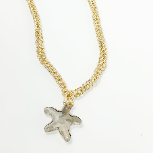 Necklace made with TPC wire with hooks and crystal star grey tones.