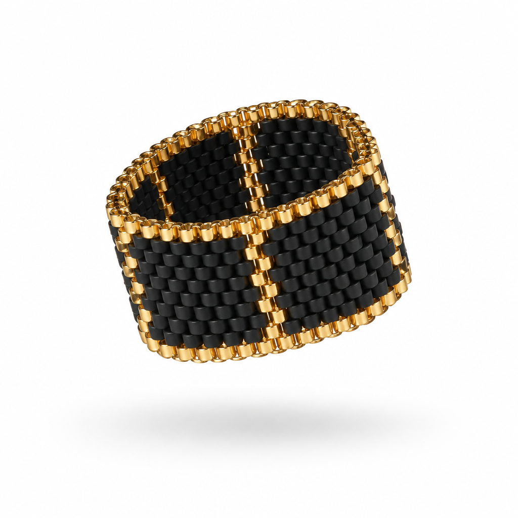Linear 13 mm Miyuki Delica ring with black beadwork and gold-tone geometric accents