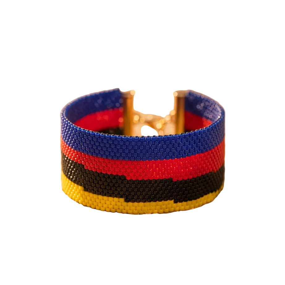 Dailot wide beaded bracelet with blue, red, black, and yellow horizontal stripes and gold-tone accents on a white background.