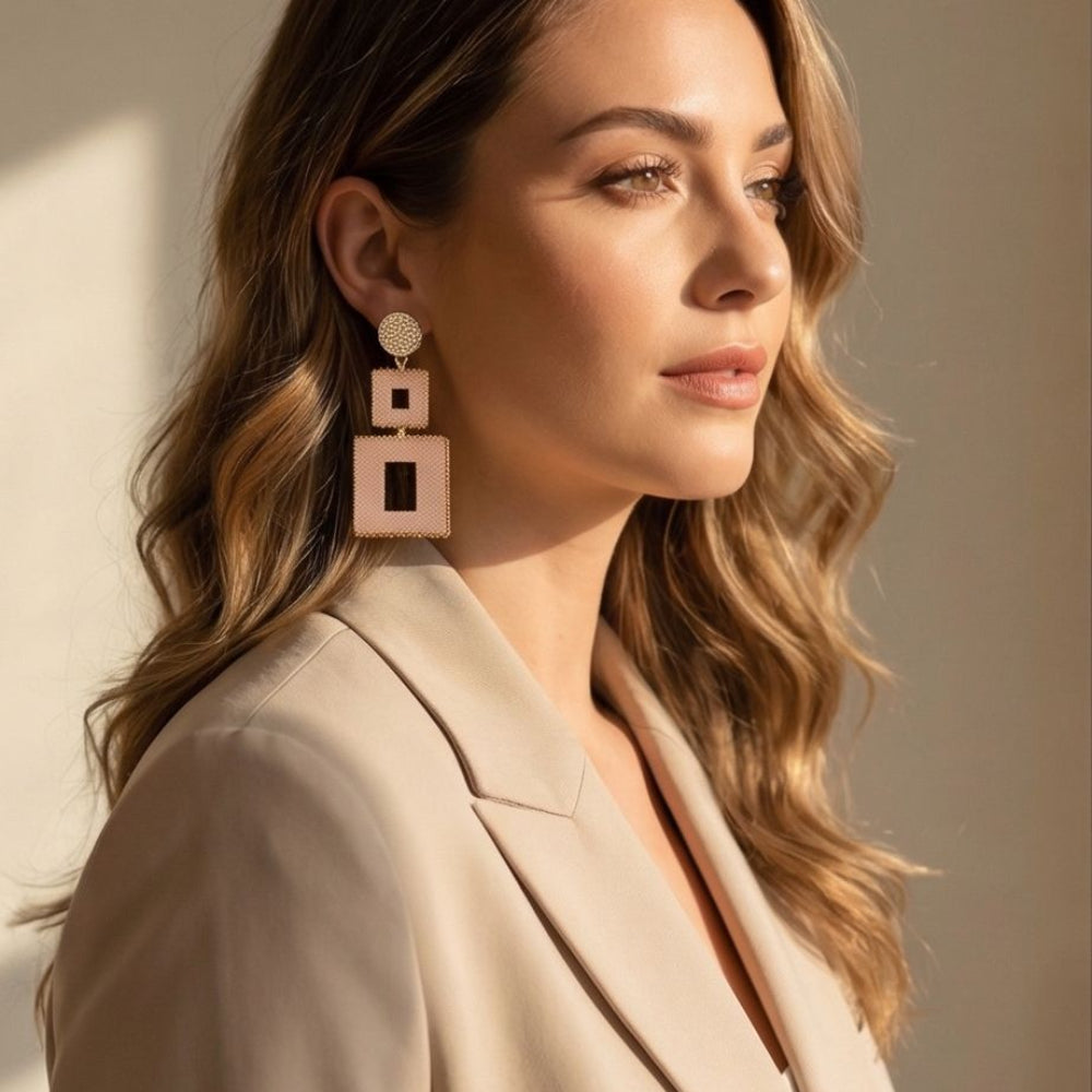 Model wearing Dailot peach geometric Miyuki statement earrings