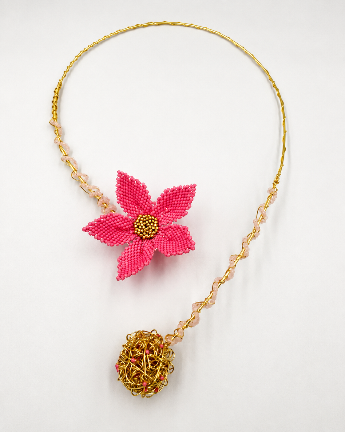 Dailot Fleur handmade pink flower statement necklace with Miyuki beadwork and gold-tone wire details.