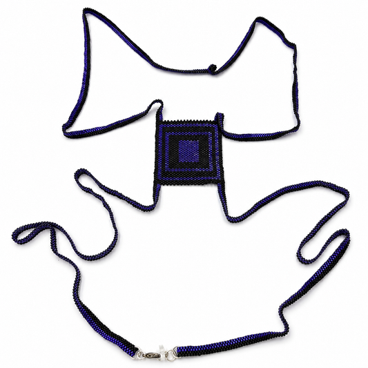 Purple and black Miyuki Delica cross body chain with a square geometric centerpiece and silver-tone clasp on a white background.