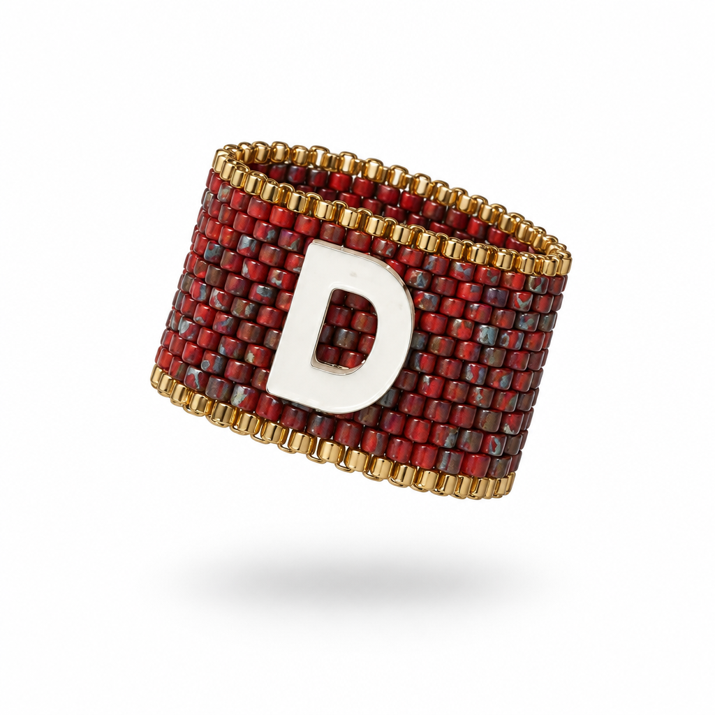 Signatus 15 mm Miyuki Delica ring with red beadwork, gold-tone accents and mother-of-pearl initial
