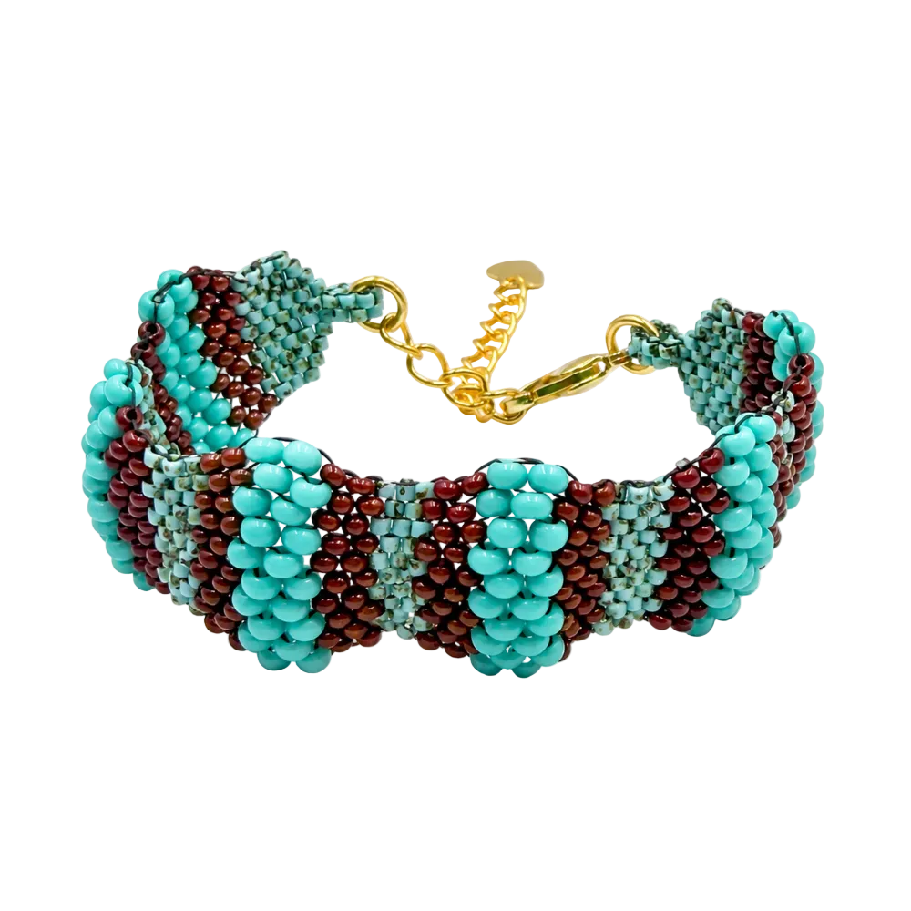 Dailot turquoise and burgundy beaded bracelet with scalloped edges, pale aqua accents, and a gold-tone clasp on white.