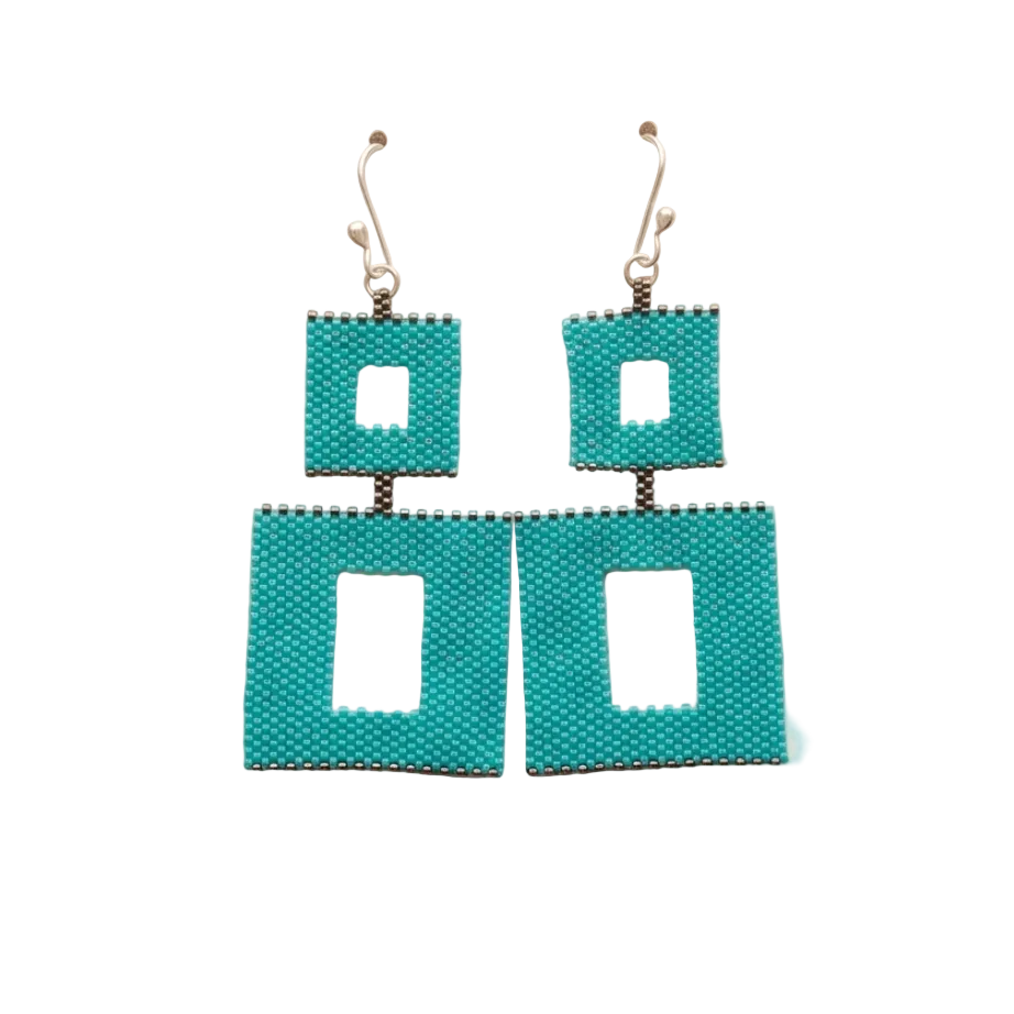 Turquoise beaded drop earrings with two open rectangular shapes and silver-tone hooks on a jewelry card over beige fabric.