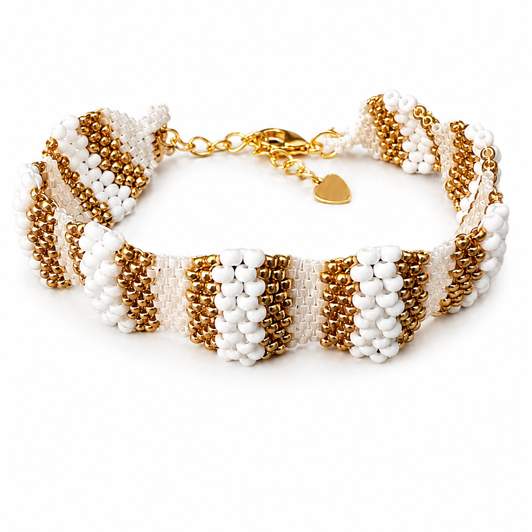 Dailot handmade white and gold Miyuki beaded bracelet with gold clasp and heart charm.