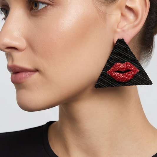 Model wearing Kiss Miyuki statement earrings with crystal lips by Dailot