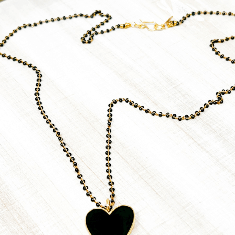 necklace made with gold plated chain and gold plated black enamel  heart pendant